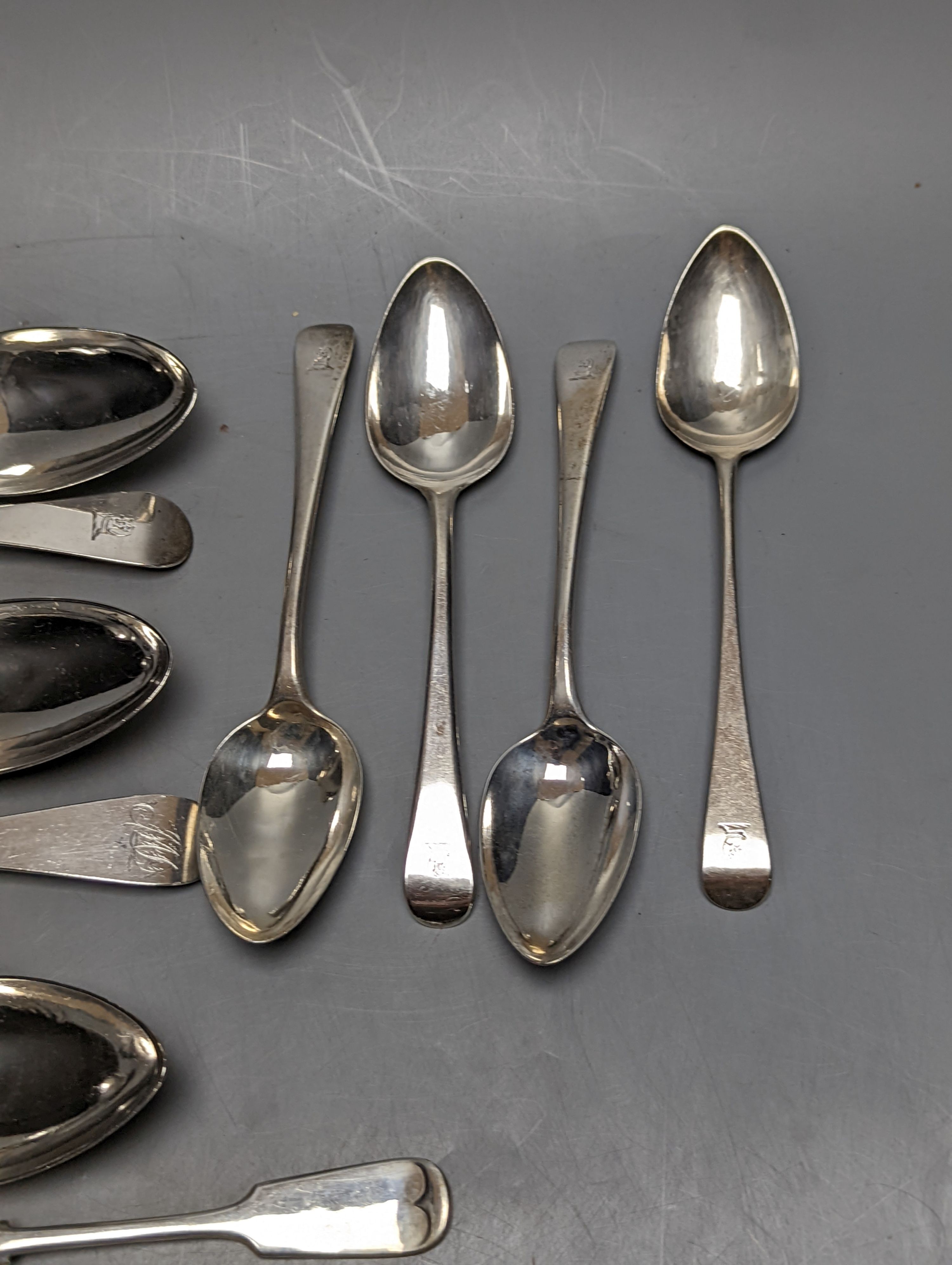 Fourteen items of 19th century and later silver flatware, various patterns, dates and maker's including three tablespoons by Eley & Fearn, London, 1817, 23oz.